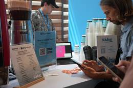 A person looking at a phone AI-generated content may be incorrect.