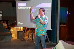 A person standing in front of a projector screen AI-generated content may be incorrect.